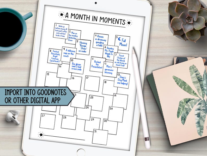 May include: A digital planner displayed on a white tablet, featuring a calendar layout titled "A Month in Moments." The planner includes numbered boxes for daily entries, with handwritten notes in blue ink. A stylus rests on the screen, and the text "Import into Goodnotes or other digital app" is visible.
