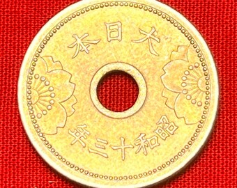 One Japanese WWII Era (1938-1940) Holed 5 Sen Coin Featuring
