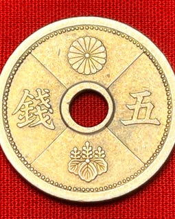One Japanese WWII Era (1938-1940) Holed 5 Sen Coin Featuring