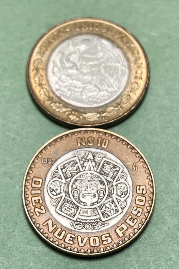 炎のマスクをあしらったシルバー コア バイメタル メキシコ 10 ペソ