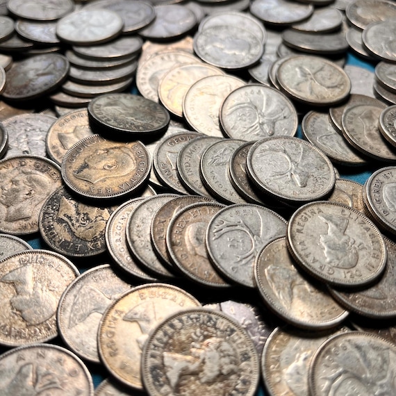 1968年以前の銀製カナダ鹿モチーフ25セント硬貨（流通グレード3種類