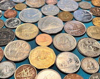 May include: A collection of various coins from around the world, featuring different designs and denominations. The coins are mostly gold and silver, with some copper and bronze coins. Some of the coins feature ships, boats, and other nautical imagery.