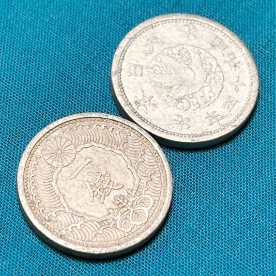One JAPANESE WWII Era (1938-1940) Holed 1 Sen Coin Featuring