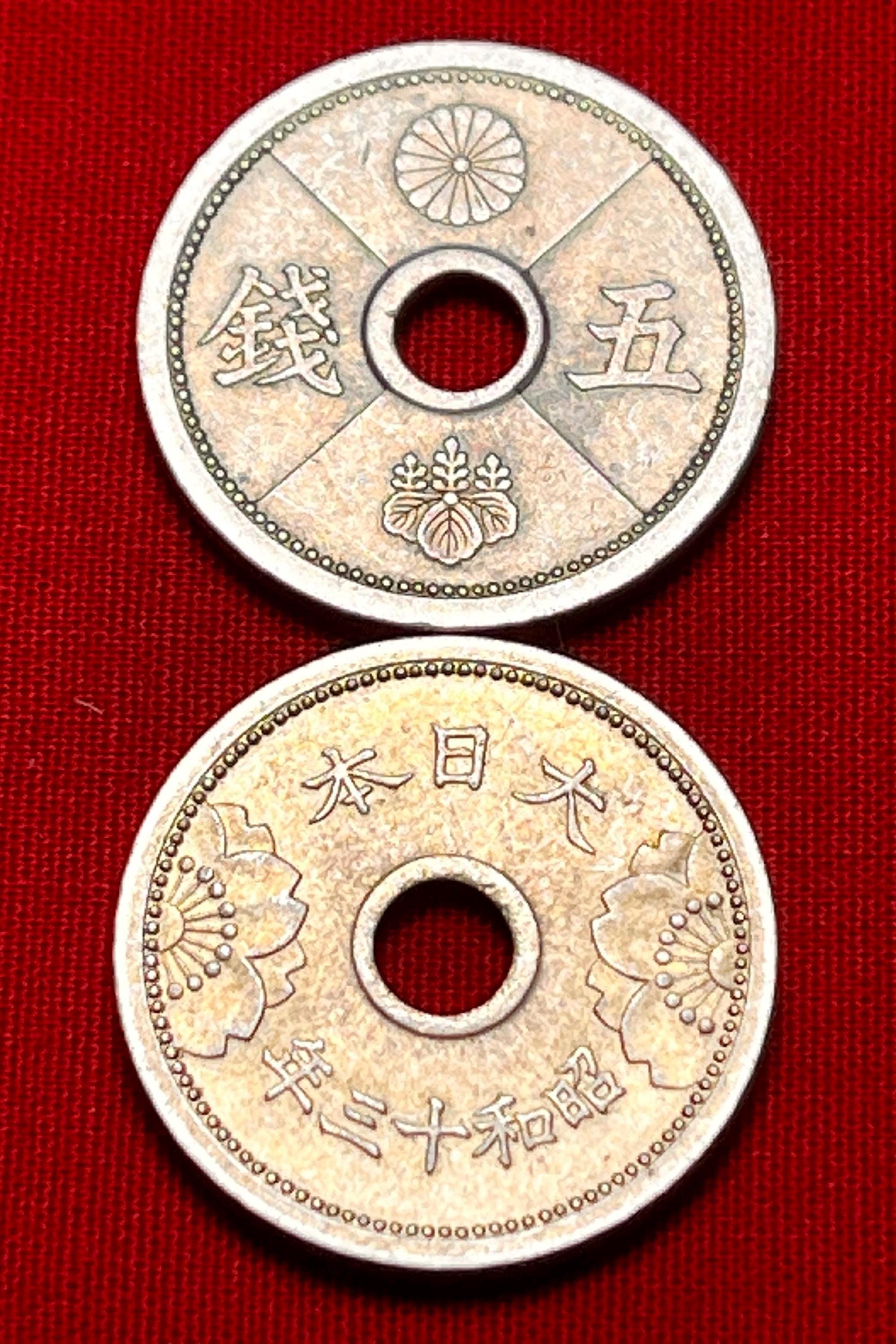 One Japanese WWII Era (1938-1940) Holed 5 Sen Coin Featuring