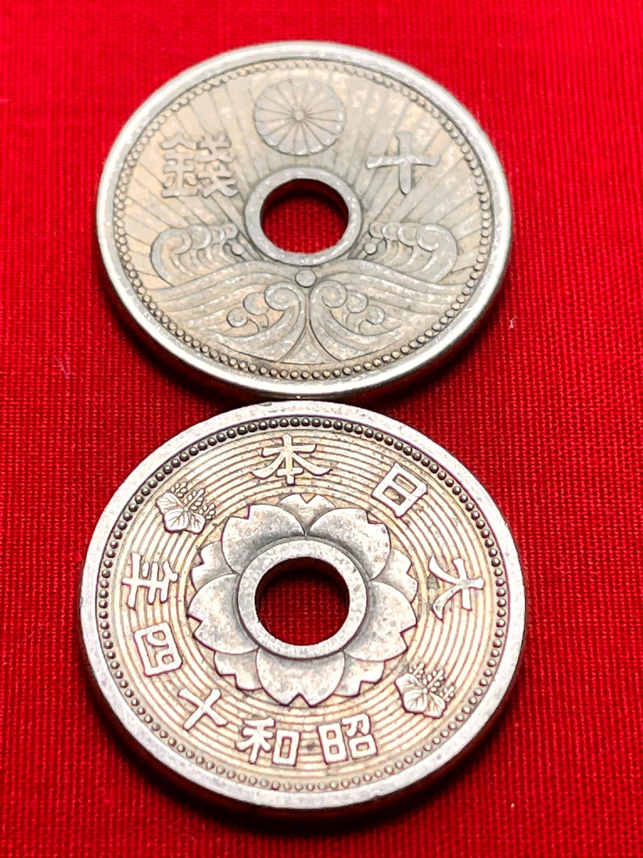 One JAPANESE 1938-1940 Holed 10 Sen Coin Featuring Imperial