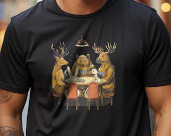 May include: A black t-shirt with a graphic print of a bear, two deer, and a rabbit playing cards at a table.