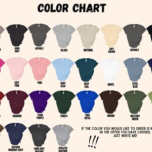 May include: Colour chart displaying 36 different t-shirt colours. The colours are arranged in rows and columns, with the names of each colour listed below each swatch. The colours include: Pebble Brown, Dark Grey, Asphalt, Silver, Natural, Soft Cream, Asphalt, Black, Berry, Soft Pink, Pink, Baby Blue, Deep Teal, White, Steel Blue, Navy, Cardinal Red, Maroon, Team Purple, Forest, True Royal, Brown, Military Green, Heather Green, Heather Brown, Heather Midnight Navy, Dark Grey Heather, Athletic Heather.