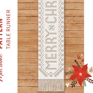 May include: White macrame table runner with the word "Merry" woven into the design. The runner is on a wood background with a red poinsettia and green leaves.