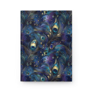 May include: A hardcover journal with a vibrant peacock feather design. The cover features a repeating pattern of blue, teal, and gold peacock feathers against a dark blue and purple background. The journal is rectangular and appears to be new.