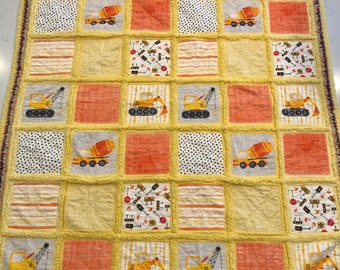 Construction Trucks Rag Quilt. Boys and girls will love it. 1 of a kind! Popular for anyone who loves big trucks for any age!Handmade quilt.