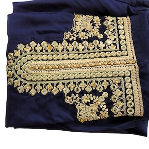 May include: A navy blue fabric with gold embroidery and mirror embellishments. The embroidery features floral designs and a beaded border.