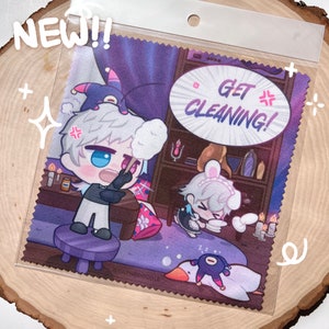 May include: A microfiber cleaning cloth featuring a cartoon illustration with the text "GET CLEANING!". The image shows a character with white hair and blue eyes, and other cartoon characters. The word "NEW!!" is in the upper left corner.