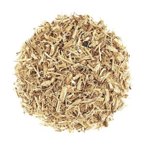 May include: A pile of light brown, shredded plant material, possibly herbs or spices, against a white background. The pieces are irregular in shape and size, with a fibrous texture.