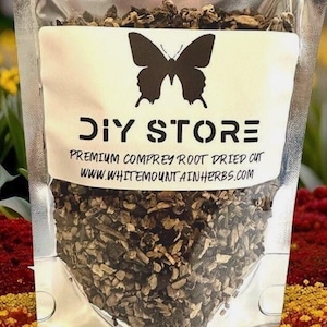 May include: A clear plastic bag filled with dried, cut comfrey root. The bag has a white label with the words "DIY STORE" and a butterfly silhouette. The label also includes the text "Premium Comfrey Root Dried Cut" and a website address.
