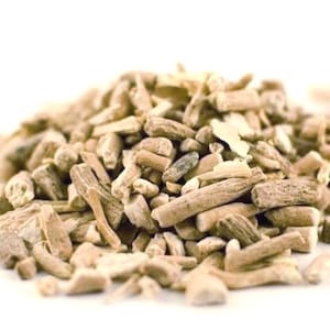 May include: A close-up shot of a collection of dried herbal roots, displaying a range of light brown and beige tones. The roots are of varying sizes and shapes, some cylindrical, others more irregular. The background is plain white, emphasizing the natural texture and colour of the herbs.