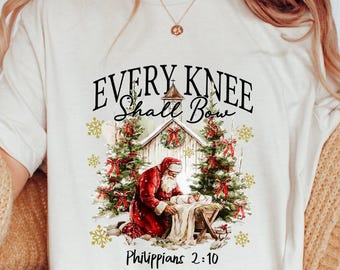 Maglietta Comfort Colors® Every Knee Shall Bow, regalo di Natale retrò, Babbo Natale, maglietta Keeling Santa, maglietta Gesù Bambino, maglietta di Natale