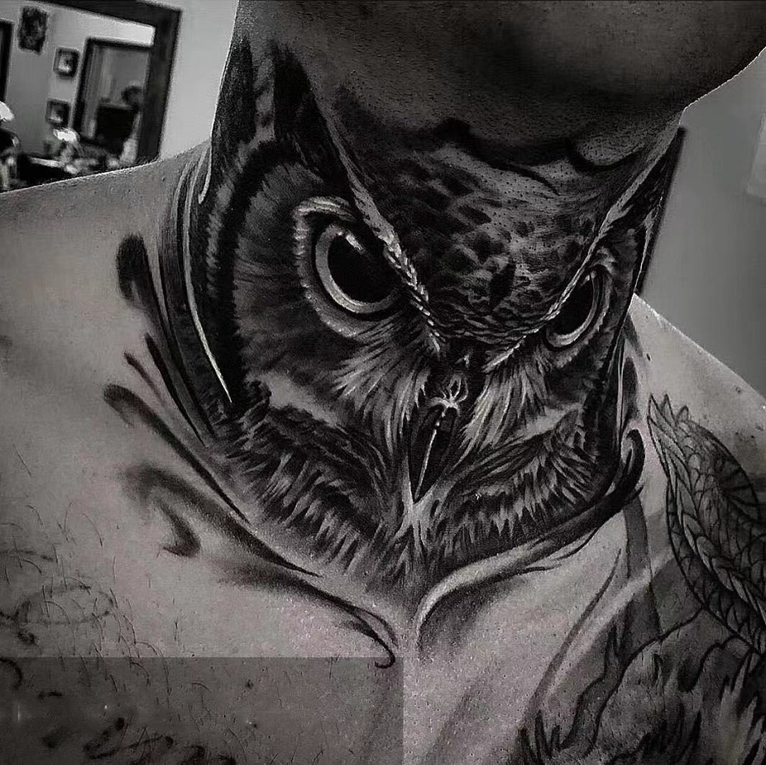 Owl throat tattoo