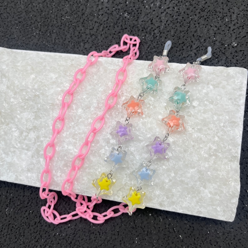 a pink chain with colorful stars on it 