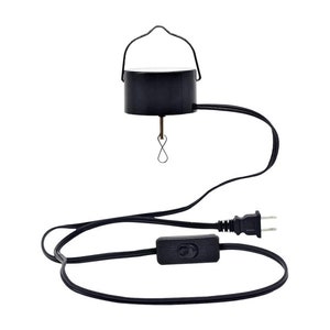 May include: A black electric wind chime with a cord and plug. The chime has a round, black base with a metal hook and a small, metal loop hanging from it.