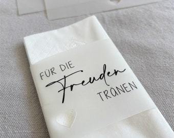 May include: White tissue paper with a white label that says "For the happy tears". The label has a small heart cutout.