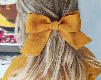 Children's hair bow on a hairpin. Linen hair bow for baby. Linen accessories. Handmade bow for hair. To decorate hair.