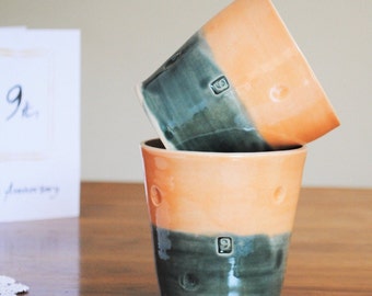 9th Wedding Anniversary Traditional Pottery Gift. Handmade mug, tumbler, unique gift for wife, husband. In dark slate grey and melon orange.