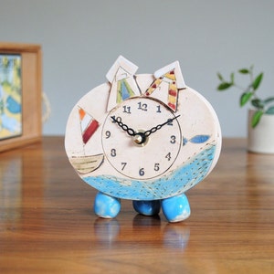 Beach huts analogue small clock. Blue fish and sailing boat. Unique nautical gift. Coastal home. Quirky bathroom decor seaside mantelpiece.