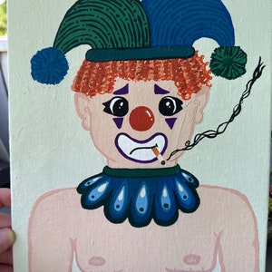 May include: A painting of a sad clown with red curly hair, a red nose, and a blue and green jester hat. The clown is smoking a cigarette and wearing a blue collar. The background is a light green color.