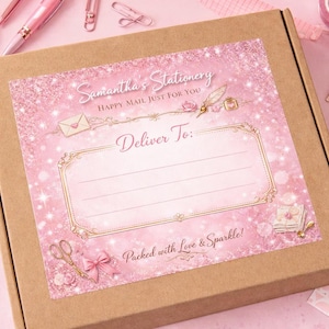 May include: A brown cardboard box with a pink label. The label reads "Samantha's Stationery" and "Happy Mail Just For You." There is space to write the delivery address, and the words "Packed with Love & Sparkle!" are also visible.