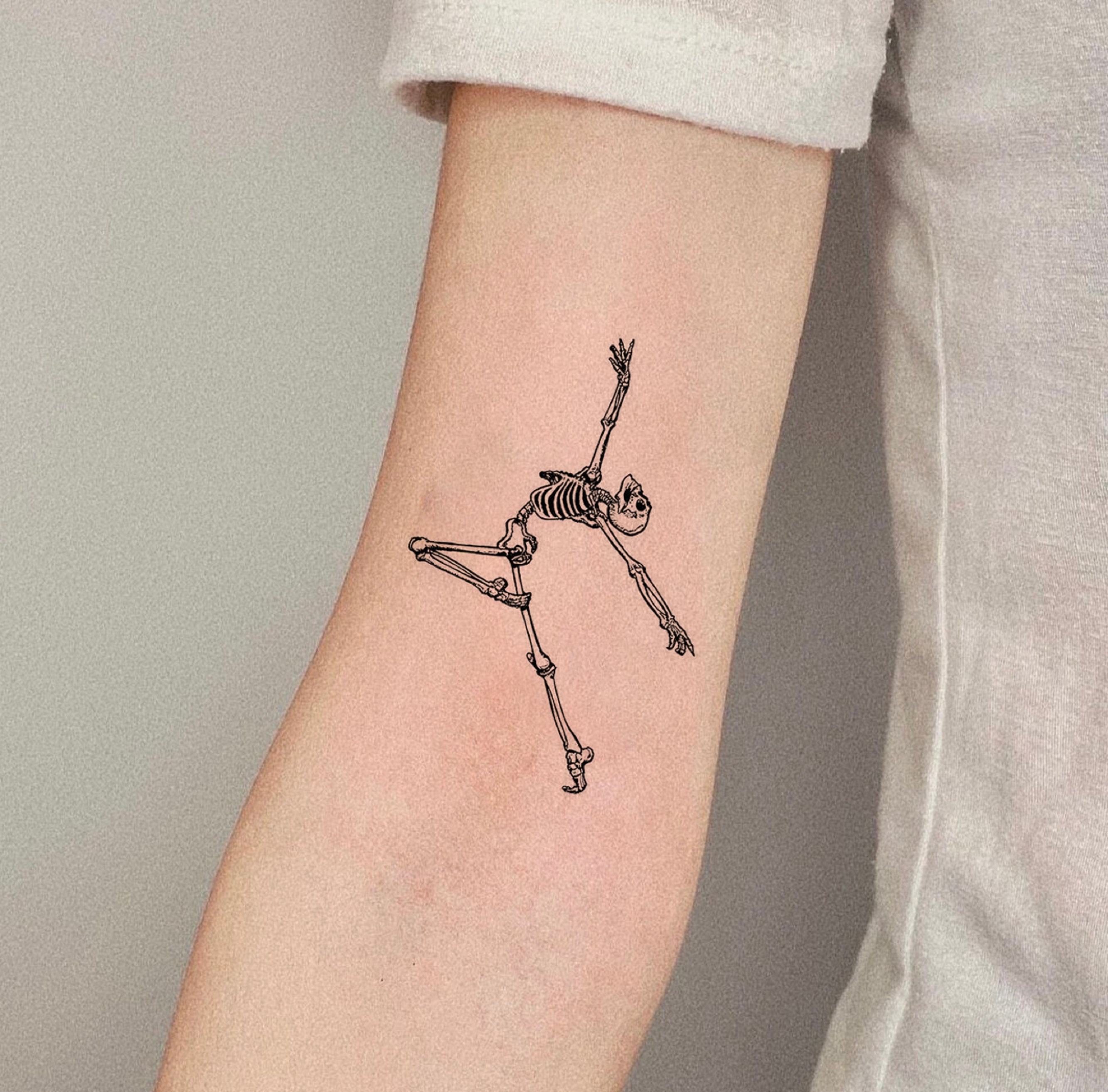 Tiny dancing skeleton tattoo  Tattoogridnet