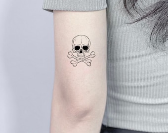 Kesha Crossbones Skull Forearm Tattoo  Steal Her Style
