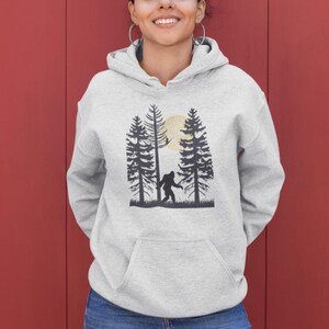 Gift for Bigfoot Lovers Hoodie - Walking Under the Moon Design for Men Women and Kids