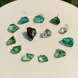 12 pcs of beautiful Polished Andara Crystal turquoise Green with Hair Fiber Inside Rare