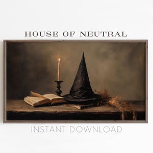 May include: A black witch's hat with a pointed crown sits on a wooden table with a lit candle and an open book. The background is a dark brown and the image has a vintage feel.