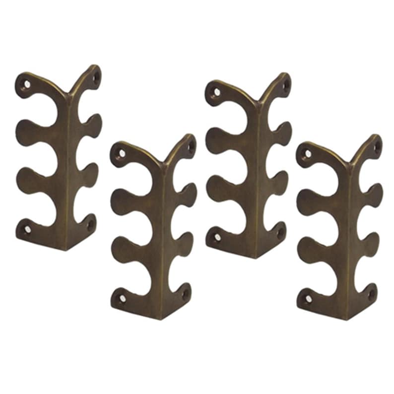 May include: Set of four antique brass corner brackets with a decorative design. Each bracket has three rounded cutouts and is designed to be attached to a corner.