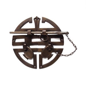 May include: Bronze-colored metal door latch with a decorative Chinese double happiness symbol design. Features a sliding bar, two oval pulls, a chain, and a ring. The latch is mounted on a white background.