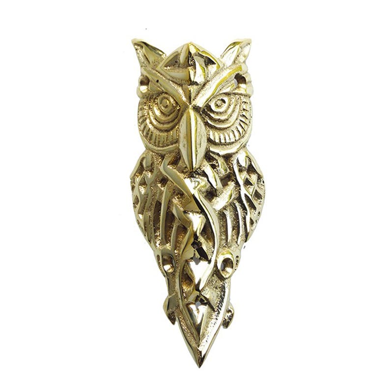 May include: A gold owl door knocker with intricate details. The owl is facing forward with its wings spread out. The knocker is made of solid brass and has a traditional design.