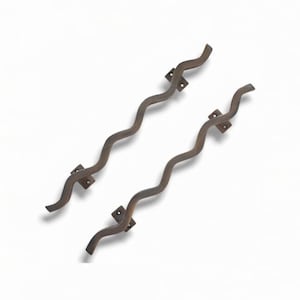 May include: Two dark bronze-toned metal door handles featuring a distinct wavy, serpentine silhouette. Each handle is equipped with two rectangular mounting plates, each containing two pre-drilled screw holes for secure installation on a door surface.