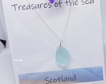 Scottish sea glass pendant in sky blue with sterling silver chain and bale.