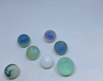 Scottish sea glass marbles in various colours and sizes (7 in total). Discovered on Scottish beaches, ideal for jewellery making and crafts.
