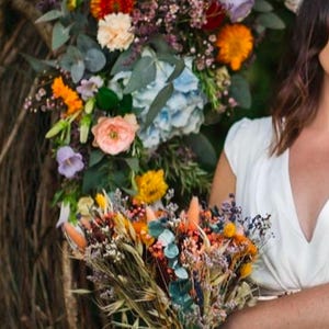 Multicolored bridal bouquet and its dried flower accessories