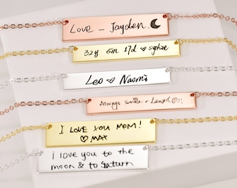 May include: Five silver and gold bar necklaces with handwritten messages. The messages include "Love - Jayden. C", "32y 6m 17d ♡ sophie", "Leo ♡ Naomi", "Always smile & Laugh!!!", "I love you MOM! ♡ MAX", and "i love you to the moon & to Saturn".