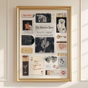 May include: A framed collage featuring a central newspaper print titled The Forever Post with the text Happy First Anniversary, surrounded by various items including photographs, a vinyl record, matchboxes, a gold key, and a playing card with the text You light up the room and Est. 12.12.2021.