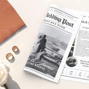 May include: A wedding-themed newspaper titled "Wedding Post" with the headline "Best Day Ever." The newspaper features a black and white photo of a couple embracing, with the words "Getting Married" below. Also visible are wedding rings, an envelope, and a pearl necklace.