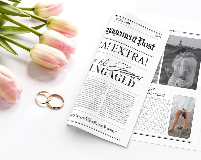 May include: A mock newspaper announcement with the headline "Engagement Post! Extra!" and the text "James & [Name] Engaged". The announcement is printed on a white background with black text. There are two gold wedding bands on a white surface.