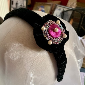 Black padded & velvet wrapped hairband with decorated button on velvet rosette