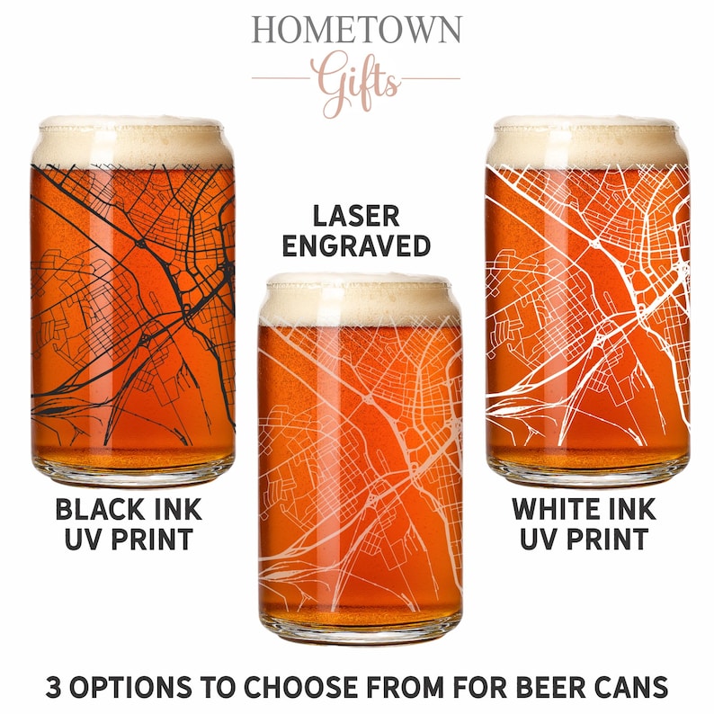 May include: Three clear glass beer cans filled with amber liquid and foam. The left glass features a black ink UV printed map, the center glass has a laser engraved map, and the right glass displays a white ink UV printed map. Text reads HOMETOWN Gifts.