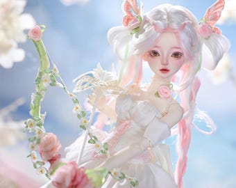 May include: A detailed doll in a white dress with pink accents, featuring butterfly-shaped hair accessories. The doll has long, flowing white hair with pink streaks and holds a floral bow. The background shows a soft, blurred sky and floral elements.