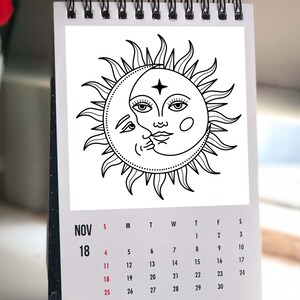 May include: A black and white illustration of a sun and moon with a face on each. The sun has a star on its forehead. The image is on a calendar page for November 18th.