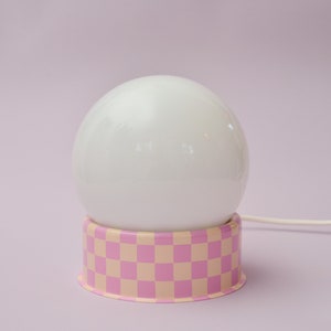 Checkered lamp with glass sphere